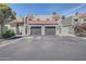 Charming townhome showcasing a red-tiled roof and a convenient two-car garage, enhancing curb appeal at 2524 S El Paradiso Dr # 82, Mesa, AZ 85202