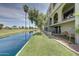 Exterior view of the property with lush green space, canal and golf course at 2524 S El Paradiso Dr # 82, Mesa, AZ 85202