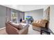 Comfortable living room area with neutral paint and plush sofa and chair at 2524 S El Paradiso Dr # 82, Mesa, AZ 85202