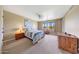 Bright main bedroom with a ceiling fan, and natural light from the windows at 2524 S El Paradiso Dr # 82, Mesa, AZ 85202