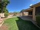 Lush backyard with pool, patio, lawn and built-in barbeque at 26449 N 84Th Dr, Peoria, AZ 85383