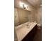 Bathroom features a large vanity area, full size mirror, and a shower with tub combination at 26449 N 84Th Dr, Peoria, AZ 85383
