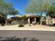 Charming single-story home featuring low maintenance desert landscaping and a two car garage at 26449 N 84Th Dr, Peoria, AZ 85383
