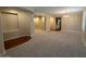 Bright and spacious living room with neutral carpet and large windows for natural light at 26449 N 84Th Dr, Peoria, AZ 85383