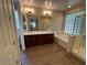 Bright bathroom with tile flooring, shower, bath and double vanity at 26449 N 84Th Dr, Peoria, AZ 85383