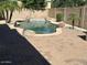 Backyard pool area with rocks and surrounding palm trees at 26449 N 84Th Dr, Peoria, AZ 85383