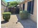 Fenced side yard with gravel and pruned shrubs at 26449 N 84Th Dr, Peoria, AZ 85383