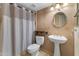 Cozy bathroom features pedestal sink, a decorative mirror, and a shower-tub combination at 3235 E Camelback Rd # 124, Phoenix, AZ 85018