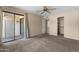 Comfortable bedroom with sliding glass door access to the balcony and a large walk-in closet at 3235 E Camelback Rd # 124, Phoenix, AZ 85018