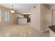 Open dining area with travertine floors open to the kitchen at 3235 E Camelback Rd # 124, Phoenix, AZ 85018