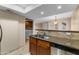 Kitchen with stainless steel dishwasher and view of laundry area at 3235 E Camelback Rd # 124, Phoenix, AZ 85018