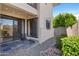 Private patio with decorative lighting, stone flooring, and sliding glass doors to the interior at 3235 E Camelback Rd # 124, Phoenix, AZ 85018