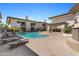 Community pool and sundeck featuring lounge chairs for relaxation and enjoyment at 3235 E Camelback Rd # 124, Phoenix, AZ 85018