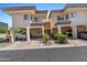 Inviting condo complex featuring covered parking, desert landscaping, and a charming facade at 3235 E Camelback Rd # 124, Phoenix, AZ 85018