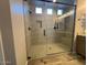 Modern bathroom featuring a glass-enclosed shower with a tiled surround and contemporary fixtures at 3248 W San Cristobal Rd, San Tan Valley, AZ 85144
