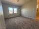 A large bedroom features carpet flooring and multiple windows for ample natural light at 3248 W San Cristobal Rd, San Tan Valley, AZ 85144