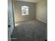 Cozy bedroom with plush carpeting and a window offering natural light, creating a relaxing space at 3248 W San Cristobal Rd, San Tan Valley, AZ 85144