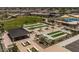 Aerial view showcasing the community's meticulously maintained bocce ball courts and shaded picnic area at 3248 W San Cristobal Rd, San Tan Valley, AZ 85144