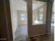 Open-concept entryway showcasing modern design with unique architectural details and neutral color palette at 3248 W San Cristobal Rd, San Tan Valley, AZ 85144