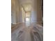 Inviting hallway with wood-look tile flooring, offering a clear view of the home's layout and design at 3248 W San Cristobal Rd, San Tan Valley, AZ 85144