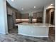 A well-equipped kitchen features a large island, granite countertops, and ample cabinet space at 3248 W San Cristobal Rd, San Tan Valley, AZ 85144