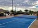 Brightly colored blue pickleball court with net, great for active community engagement at 3248 W San Cristobal Rd, San Tan Valley, AZ 85144