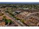 Aerial view of a vacant lot in a residential area with mature trees and desert foliage at 3911 W Oraibi Dr # 6, Glendale, AZ 85308