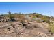 Desert lot with a winding paved road at 3911 W Oraibi Dr # 6, Glendale, AZ 85308