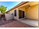Outdoor patio area featuring a ceiling fan and concrete and brick tile flooring at 4214 W Marco Polo Rd, Glendale, AZ 85308