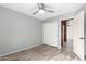 Bedroom featuring hard wood flooring and large sliding closet doors at 4214 W Marco Polo Rd, Glendale, AZ 85308