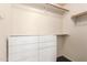 A walk-in closet featuring built-in shelving and dresser at 4214 W Marco Polo Rd, Glendale, AZ 85308