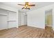 Well-lit bedroom with a built-in closet and wood-look floors at 4346 W Mescal St, Glendale, AZ 85304