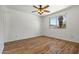 Relaxing bedroom with wood-look floors and a window offering natural light at 4346 W Mescal St, Glendale, AZ 85304