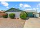 Pleasant home exterior with tidy landscaping, gravel yard and a covered parking area for convenience at 4346 W Mescal St, Glendale, AZ 85304