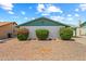 Picture of a front yard featuring minimal landscaping and a painted brick facade under a sunny sky at 4346 W Mescal St, Glendale, AZ 85304