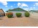 Picture of home featuring minimal landscaping and a painted brick facade under a sunny sky at 4346 W Mescal St, Glendale, AZ 85304