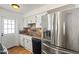 Kitchen showing stainless steel refrigerator and black appliances at 4346 W Mescal St, Glendale, AZ 85304