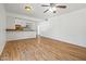 Open living area with wood-look floors next to the kitchen at 4346 W Mescal St, Glendale, AZ 85304