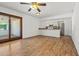Living area showcasing kitchen access and sliding door entrance at 4346 W Mescal St, Glendale, AZ 85304