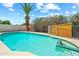 Backyard pool with mature landscaping, surrounded by a concrete deck and fence with a shed at 4346 W Mescal St, Glendale, AZ 85304