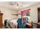 A bedroom featuring a ceiling fan and window at 4438 W Hatcher Rd, Glendale, AZ 85302