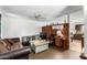 Comfortable living room featuring a ceiling fan and a mix of furnishings at 4438 W Hatcher Rd, Glendale, AZ 85302