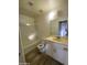 Clean bathroom with tub shower, vinyl floor, and vanity sink at 4820 N 89Th Ave # 88, Phoenix, AZ 85037