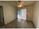 This carpet-free bedroom features a ceiling fan and sliding glass door at 4820 N 89Th Ave # 88, Phoenix, AZ 85037