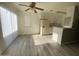 Bright kitchen features white cabinets, modern appliances, and luxury vinyl flooring, creating a welcoming culinary space at 4820 N 89Th Ave # 88, Phoenix, AZ 85037