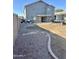 View of the backyard with covered patio and trampoline at 491 E Jeanne Ln, San Tan Valley, AZ 85140