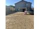 Expansive backyard featuring a covered patio, trampoline, and ample space for outdoor activities at 491 E Jeanne Ln, San Tan Valley, AZ 85140