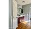 Bathroom with a double vanity, mirror and a storage closet at 491 E Jeanne Ln, San Tan Valley, AZ 85140