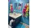 Charming bathroom with vanity, bright walls, and colorful hair bow display for a playful space at 491 E Jeanne Ln, San Tan Valley, AZ 85140