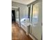 Bathroom featuring a shower tub combo with sleek glass doors and modern fixtures at 491 E Jeanne Ln, San Tan Valley, AZ 85140